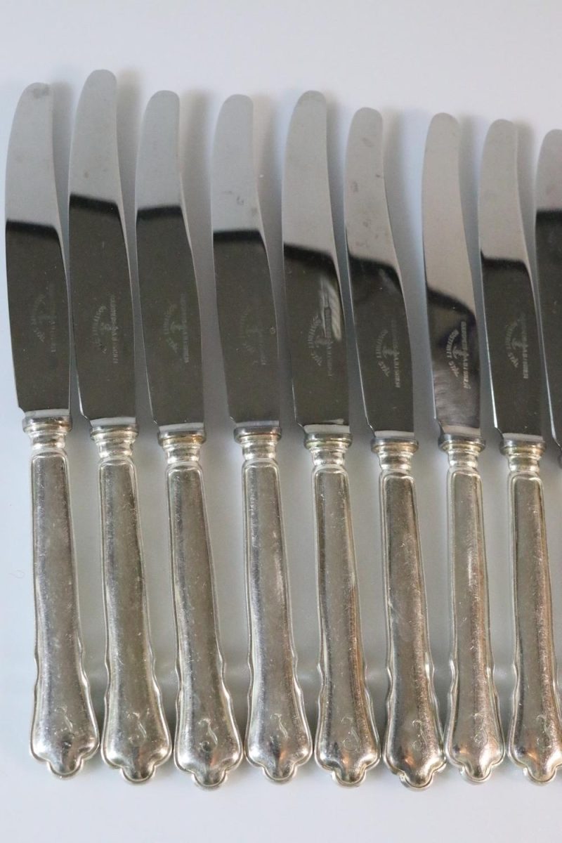 Knivar, märkta "Guldsmeds AB i Sthlm", rostfritt, 12 delar