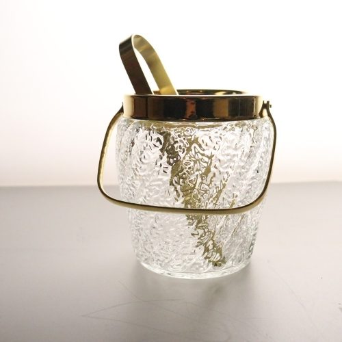 Ishink med tång, glas och metall