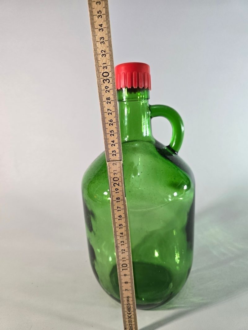 Stor flaska i grönt glas, troligen Frankrike