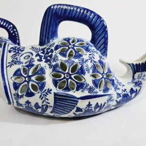 Ett par Koi Fiskformade Ljushållare