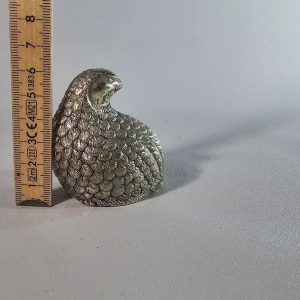Vaktelformad  pepparshaker i nysilver och ett pasr droppstopp ringar