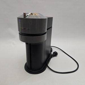 Kanna, llila glas med intryckta sidor
