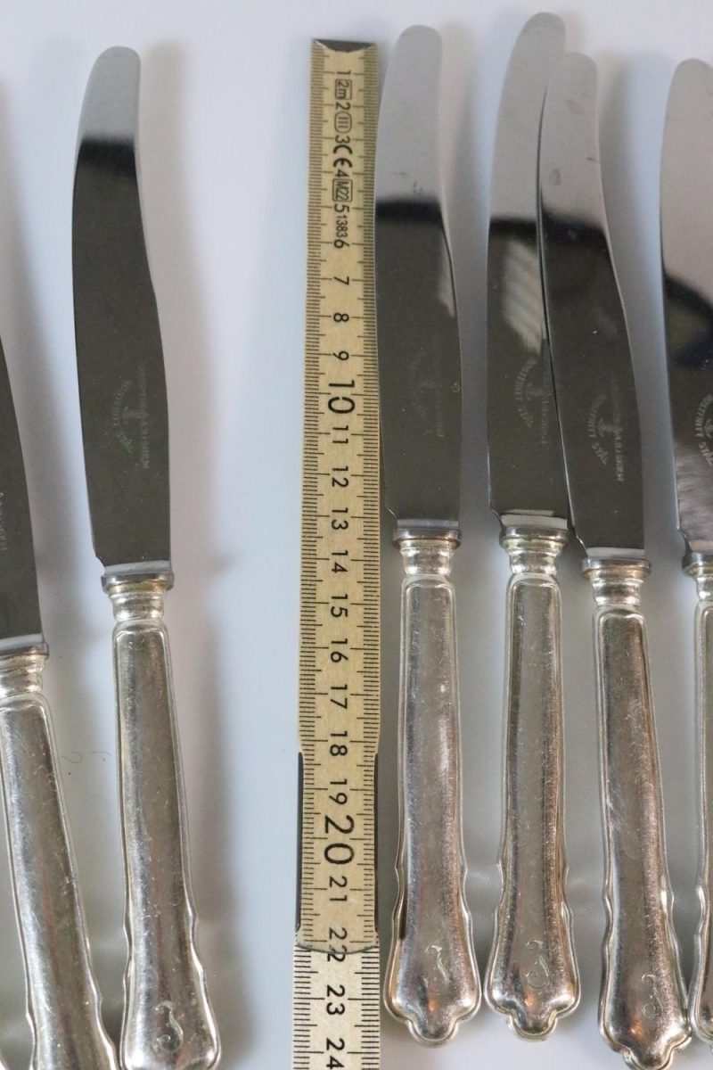 Knivar, märkta "Guldsmeds AB i Sthlm", rostfritt, 12 delar