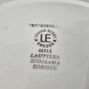 Ovalt fat, UE GEFLE, "REVÄTKUKKA" LASITTEEN SUOJAAMA KORISTE