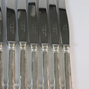 Knivar, märkta "Guldsmeds AB i Sthlm", rostfritt, 12 delar