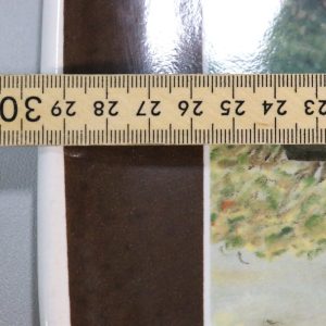 Väggfat från Höganäs med motiv efter Alma Örnströms målningar ca 30x24cm