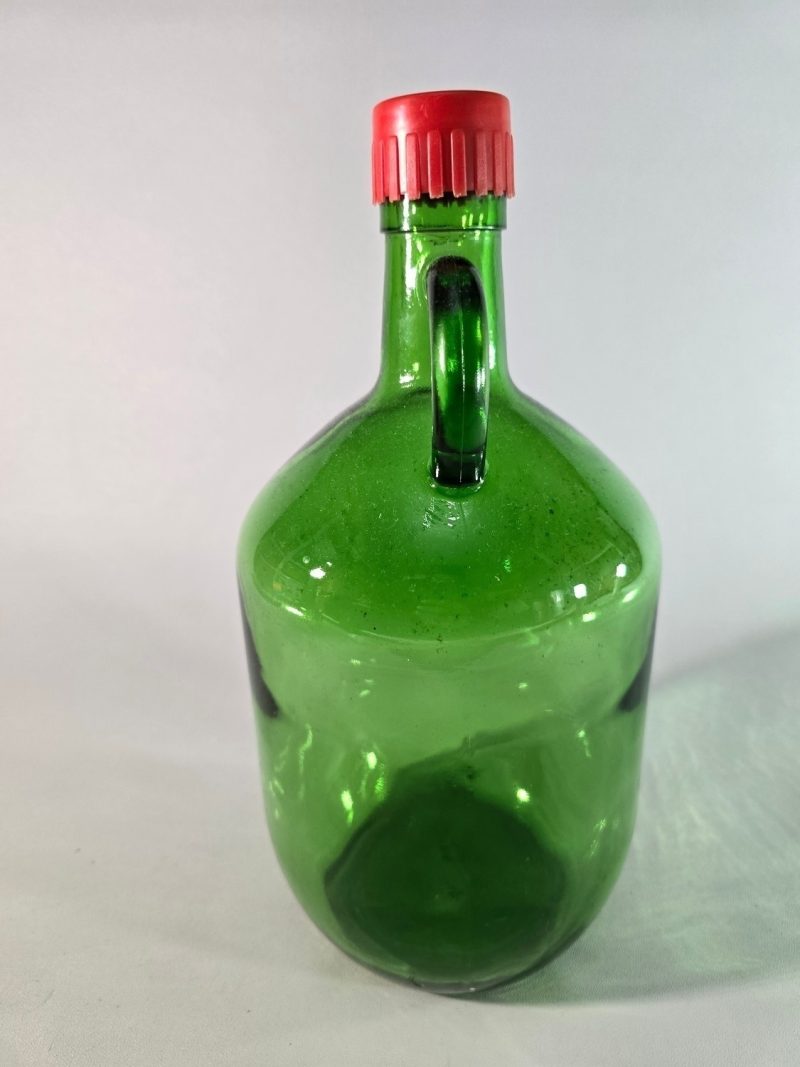 Stor flaska i grönt glas, troligen Frankrike